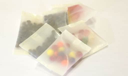 Colorful candy sealed in Cellulose custom packaging and stacked on top of each other